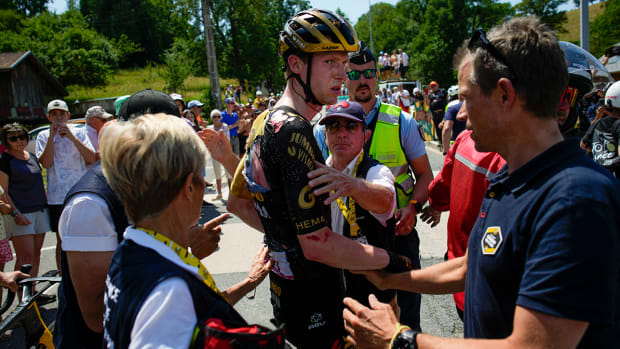 Doctors tend to Belgium’s Nathan van Hooydonck who crashed during the fifteenth stage of the Tour de France cycling race over 179 kilometers (111 miles) with start in Les Gets Les Portes du Soleil and finish in Saint-Gervais Mont-Blanc, France.